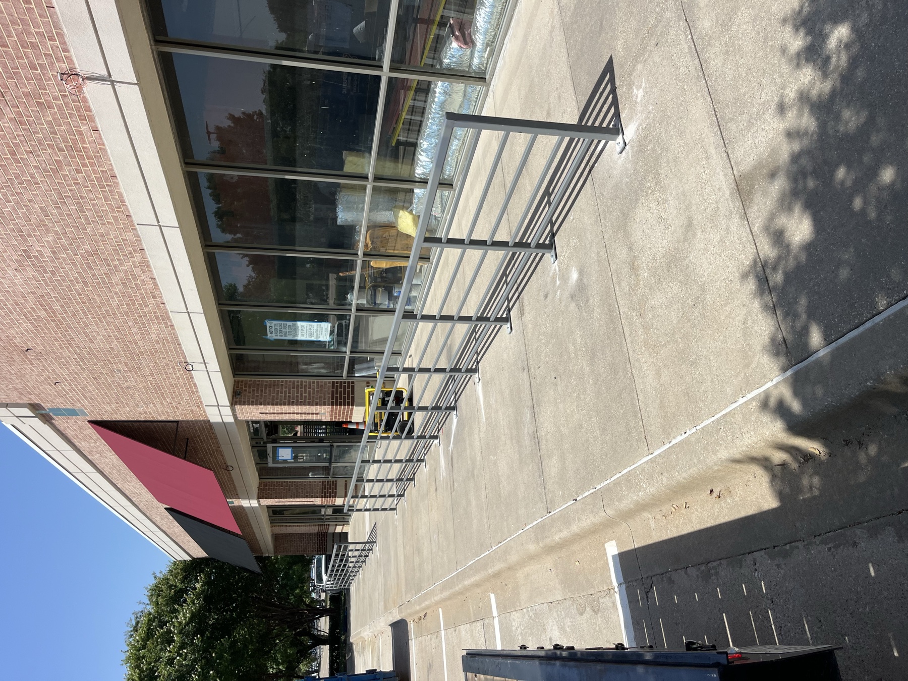 Commercial exterior steel railing installed outside retail storefront